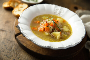 Homemade vegetable soup with smoked bacon