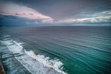 Fototapeta premium Drone view a cold front over Bass Strait from the coast at Point Lonsdale, Victoria, Australia. May 2022