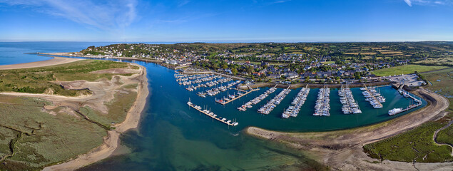 Aerial panoramic image of Carteret marina and estuary on a sunny day in France