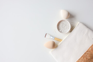 Makeup accessories, brushes and sponges,pink pastel background,flat layot