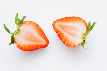 Close up view of cut strawberry on white background.