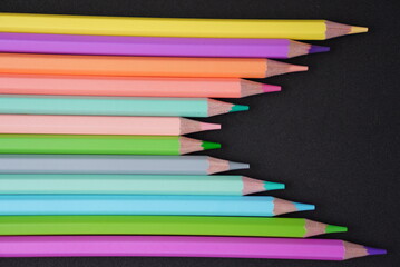 Pastel color lapis on black background leave space to put text message, logo space