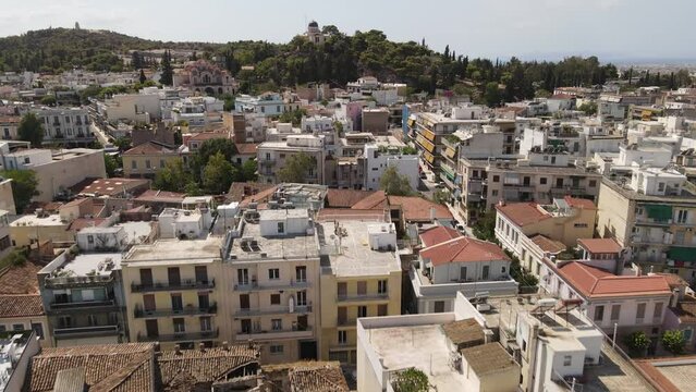 Athens, Greece. Aerial View of Downtown Residential Buildings and National Observatory on Hill Above Thissio Neighborhood, Drone Shot