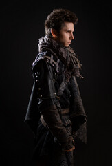 A guy in a steampunk or post-apocalyptic image, portrait on a black background