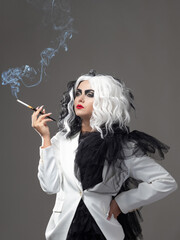 A fatal beauty in a daring fashion image with black and white hair. A rebellious stylish image for...