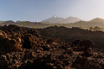 Volcanic landscape. Black rocky texture of cooled lava in Teide national park, Tenerife.