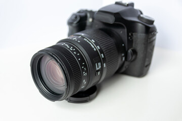 Professional dslr camera equipment with 70-300 mm tele zoom objective with wide camera lens in macro close-up view shows details of photographic equipment for studio shots and portrait wildlife photos