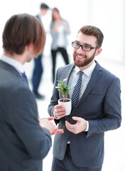 successful young businessman with young sprout