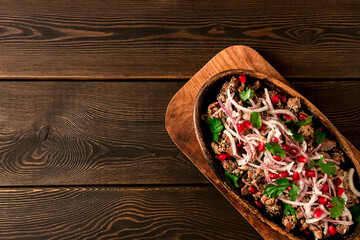 Kuchmachi, a traditional Georgian dish, in a clay Ketsi plate, close-up,