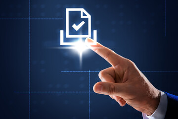 Man pointing at virtual icon of computer file on dark blue background, closeup