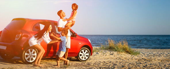 Happy family having fun near car on sandy beach. Banner design
