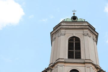 Exterior of beautiful cathedral against blue sky, low angle view