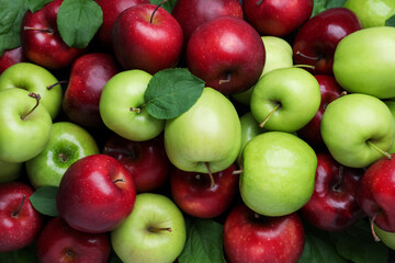Naklejka na ściany i meble Fresh ripe green and red apples as background, top view