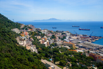 Fototapeta na wymiar Aerial view of the city of Gibraltar facing the famous strait with the mountains of Morocco in the distance