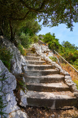 Steep walking path with stairs on the top of the Rock of Gibraltar in the south of Spain
