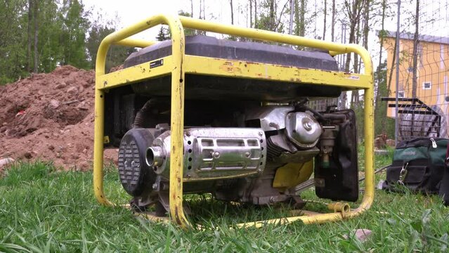 portable gasoline generator operating on a construction site