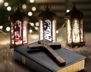 Open bible book on dark black wooden desk table space. Christ gospel literary.