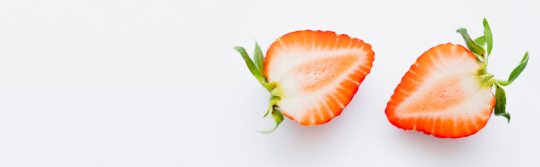 Close up view of juicy cut strawberry on white background, banner.