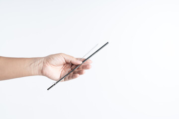 Hand holding long brush for reusable stainless steel or silver straws