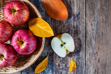 Red apples On old a wooden table.