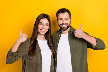 Portrait of cheerful friendly people hand fingers demonstrate thumb up isolated on yellow color background