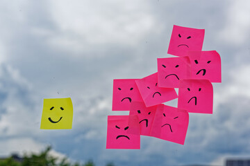 smiley sticky notes against angry post it