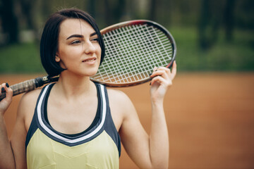 Woman playing tennis at the court