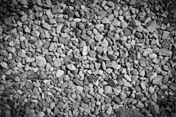 Smooth background with a pebble texture. Pebble sea beach close-up, gray dry pebbles.