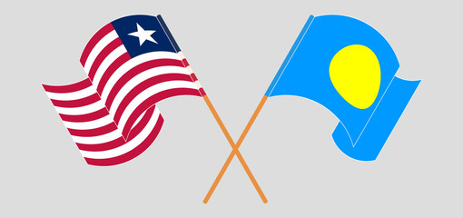 Crossed and waving flags of Liberia and Palau