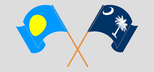 Crossed and waving flags of Palau and The State of South Carolina