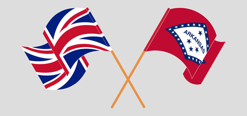 Crossed and waving flags of United Kingdom and The State of Arkansas
