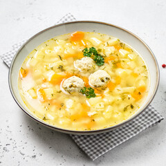 Healthy low calorie vegetable chicken meatball soup. Top view, copy space.