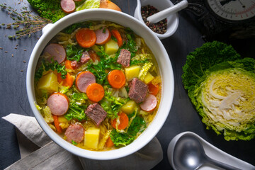 delicious savoy cabbage soup in white vase