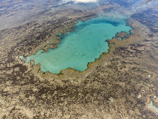 Obraz premium Amazing coral reef in the middle of the sea in Porto Seguro, Bahia, Brazil - natural beauty aerial drone view
