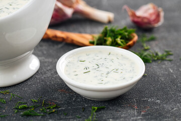 Obraz na płótnie Canvas Closeup on portion of sour cream sauce on grey background