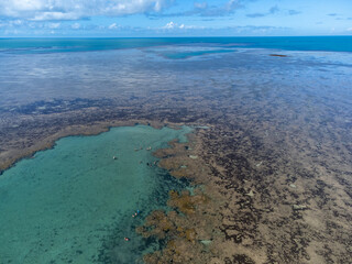 Amazing coral reef in the middle of the sea in Porto Seguro, Bahia, Brazil - natural beauty aerial drone view