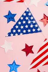 USA Independence Day concept. Top view vertical photo of national flag garland and stars on...