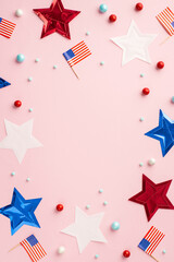 Fourth of July concept. Top view vertical photo of US national flags stars and scattered candies on...