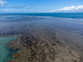 Amazing coral reef in the middle of the sea in Porto Seguro, Bahia, Brazil - natural beauty aerial drone view