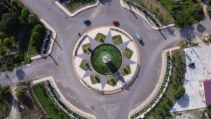 Aerial view of Bundaran Smart in Pasangkayu regency, Indonesia with Tugu Smart. City roundabout with city monument.