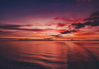 Obraz na płótnie Canvas Sunset behind the cargo vessel