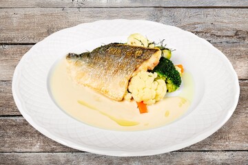Fried meat or fish with vegetable and salad on kitchen desk