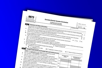 Form 8873 documentation published IRS USA 10.18.2012. American tax document on colored