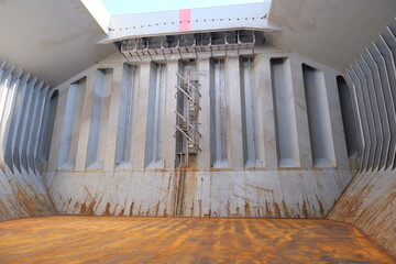 Cargo hold bulkhead with spiral (Australian) ladder of bulk carrier