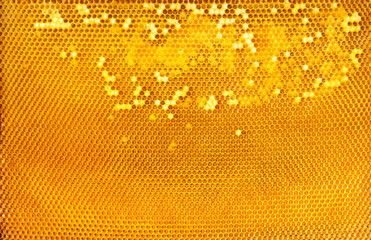 Honey frame, partially packed, background or texture.