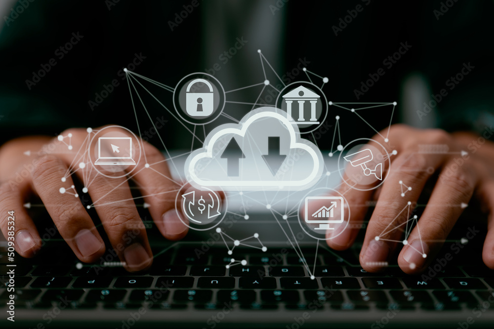 Poster A man uses a laptop that displays a schematic of cloud computing. Data storage, networking, and internet service as they relate to cloud technology.