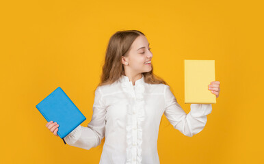 student in high school. teen girl do homework with copybook. study with workbook.