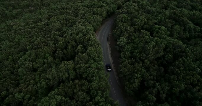 Aerial view of old Volkswagen 1990 Golf Cabrio travels in mountainous terrain