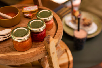 Mediterranean breakfast outdoors in the courtyard of a house, jam details