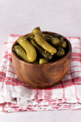 Homemade Salted Pickles in Wooden Bowl Vertical
